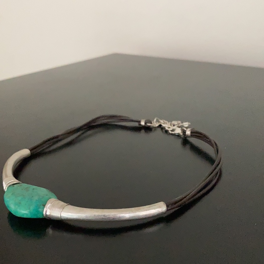 Sterling silver, blk leather & turquoise choker.